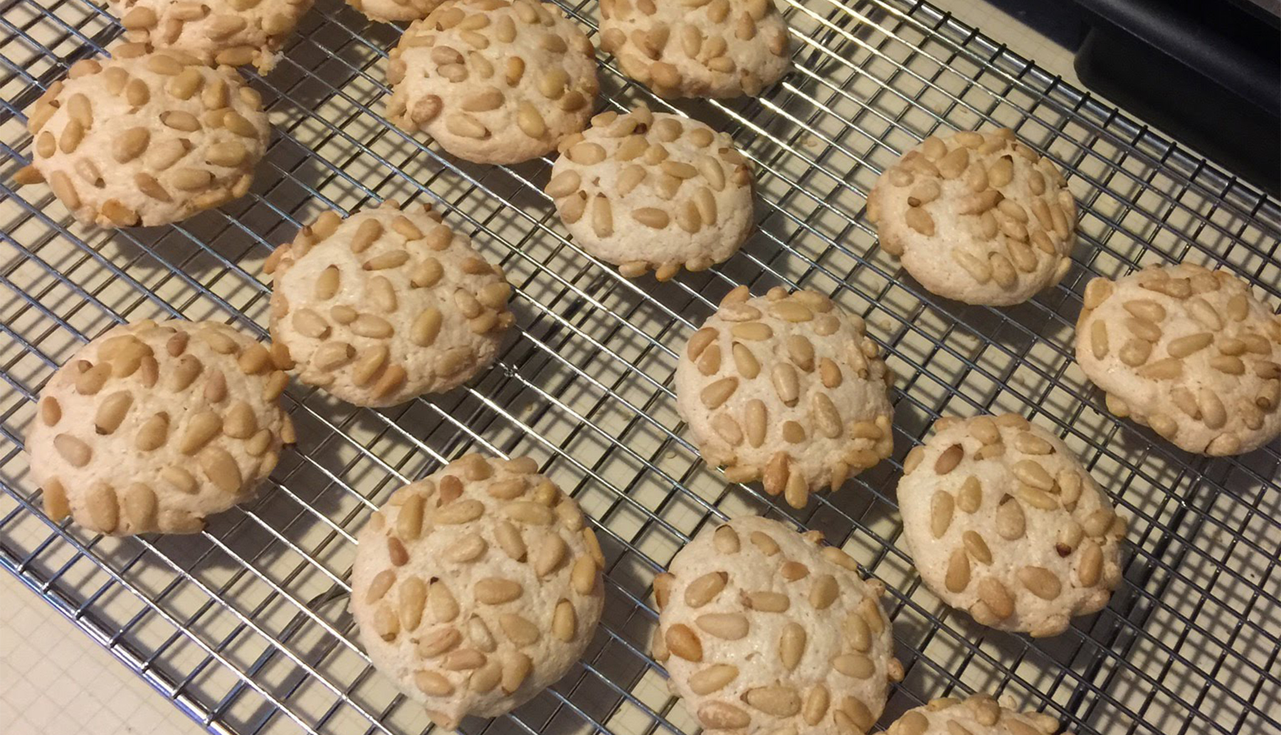 Italian Pignoli cookies on baking rack